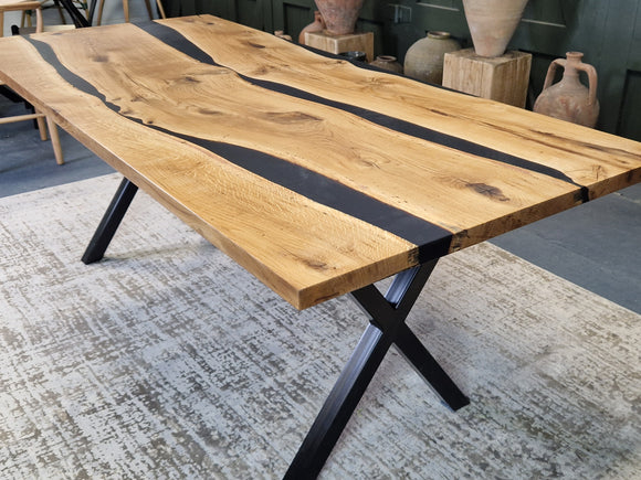 Oak dining table with with black resin