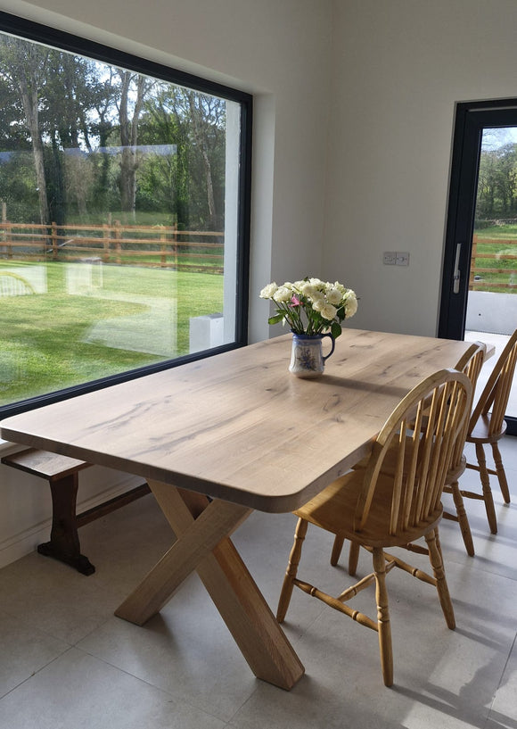Solid oak dining table with robust Oak X style legs in a choice of 4 finishes