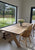 Solid oak dining table with robust Oak X style legs in a choice of 4 finishes