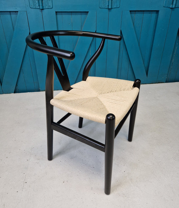 Wishbone chair designed by Hans Wegner, Scandinavian design, mid century modern furniture, black frame
