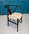 Wishbone chair designed by Hans Wegner, Scandinavian design, mid century modern furniture, black frame