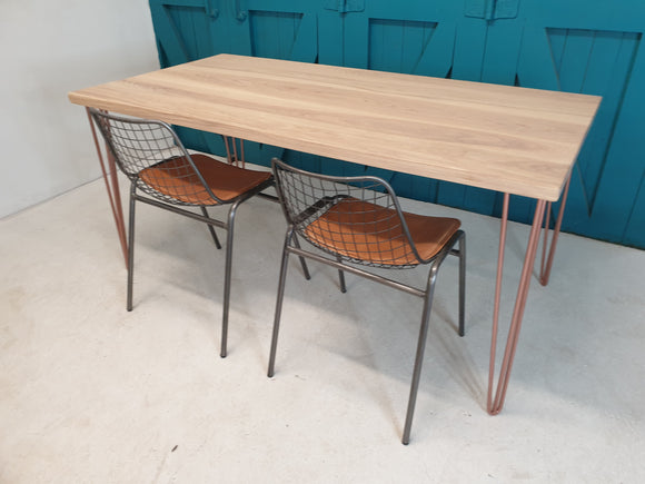 Ash dining table with hairpin legs in gold finish, €300 off original price